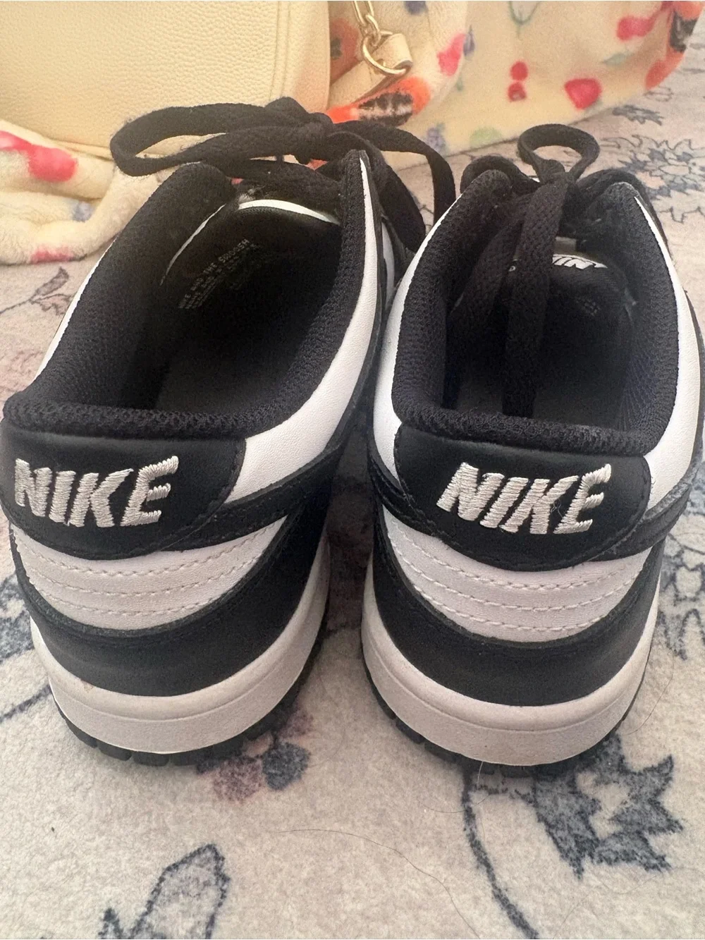 Nike women’s Black and White Low-Top Sneakers